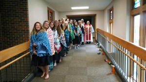 seniors with quilts and pastors